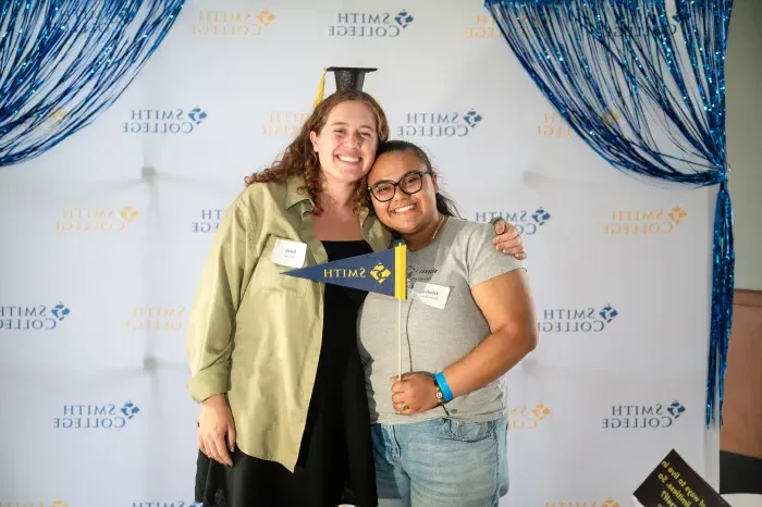 Two seniors hug each other at the soiree.